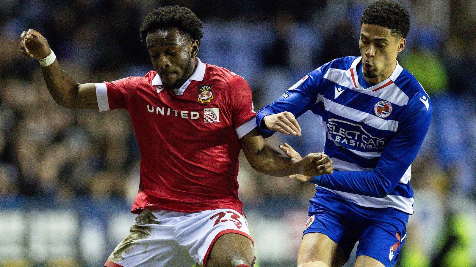 Seb Revan battles for the ball with Reading's Harvey Knibbs in March 2025