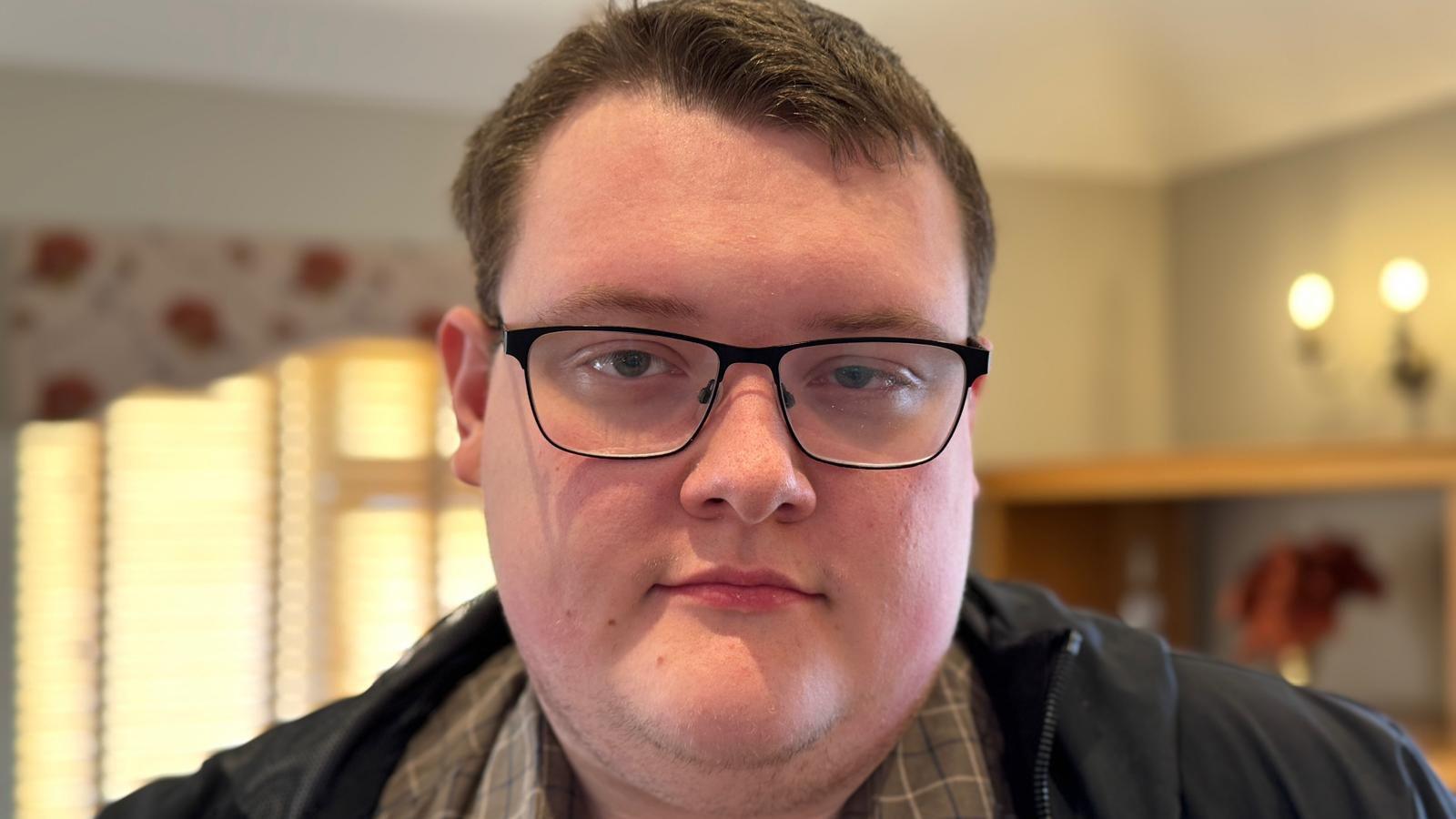 Head and shoulders photograph of councillor James Cantwell. He has short brown hair and is wearing glasses.