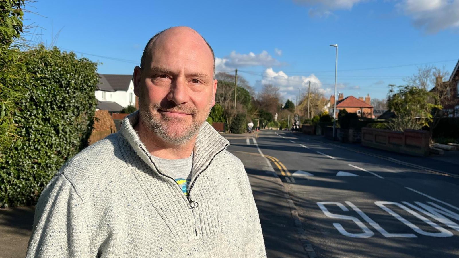 Julian Key, a resident of Castle Donington, stood near a new speed table installed on the junction of Park Lane and The Green.