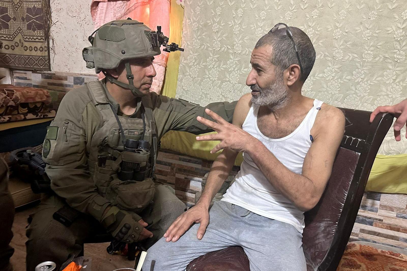 Israeli military handout photo showing Kaid Farhan Elkadi speaking to soldiers moments after his rescue in southern Gaza