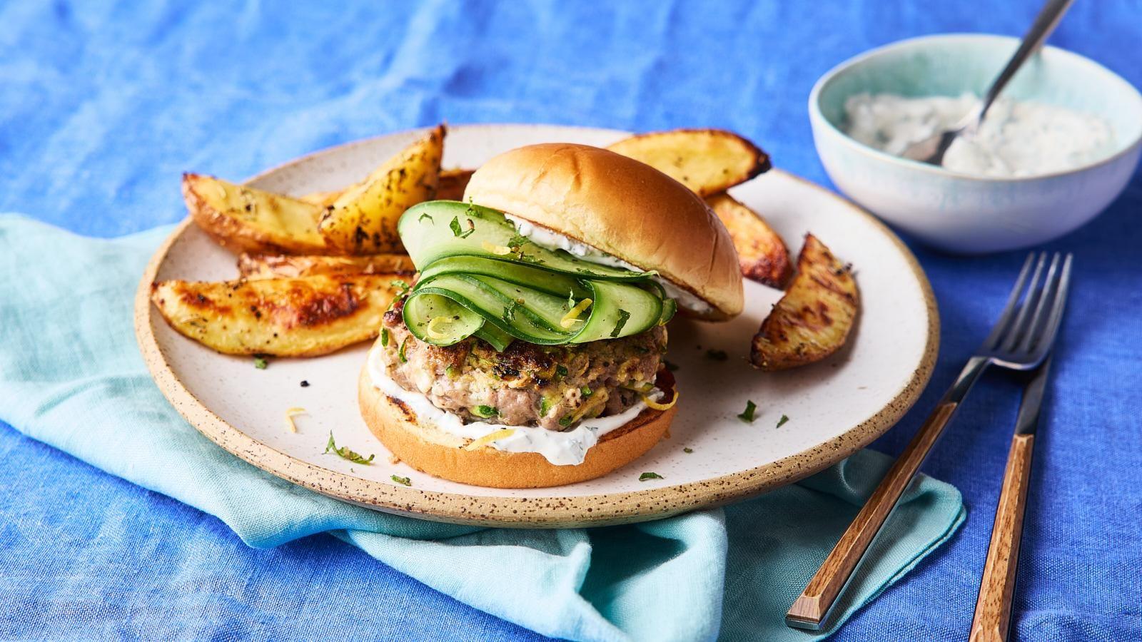 Lamb and feta burgers with potato wedges and slaw