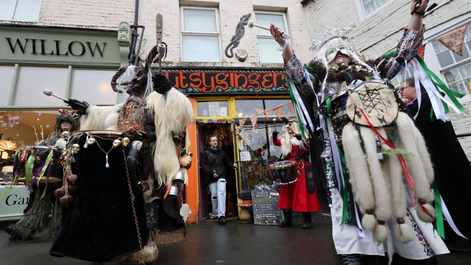 A parade of people dressed as a half goat half demon figure called Krampus in Whitby town centre 