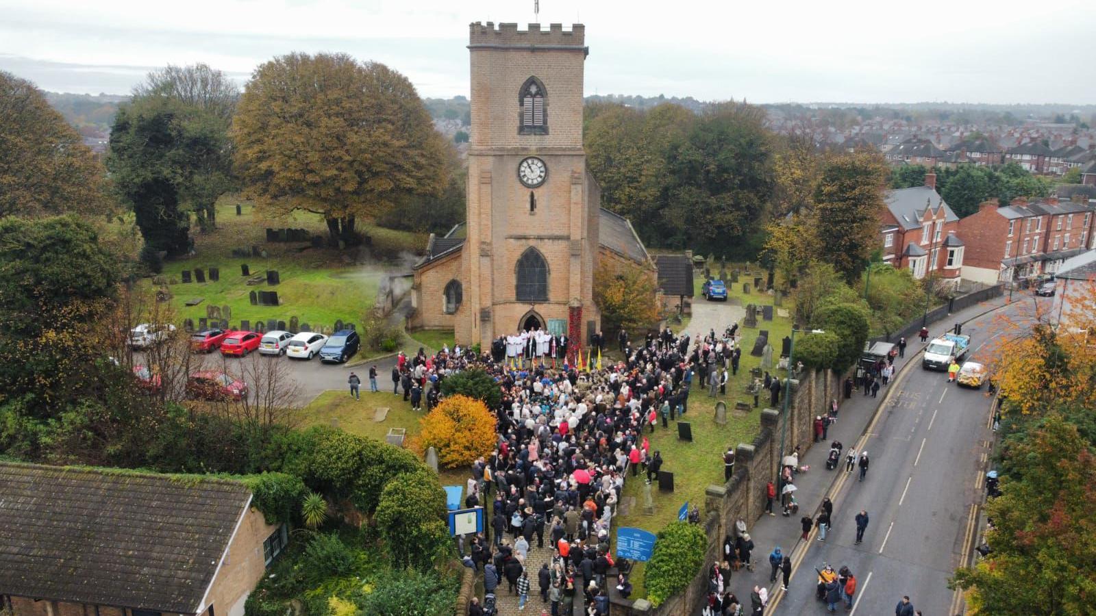 People gathered outside of Saint Mary's Church in Bulwell.