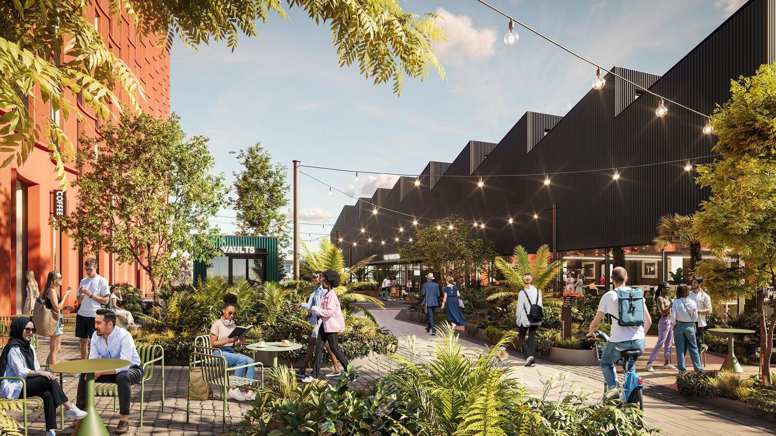 An artist's impression of the new public space which is under construction at the Goods Yard in Stoke-on-Trent. Festoon lighting can be seen over a series of tables and chairs and plants, with people interspersed around the space.