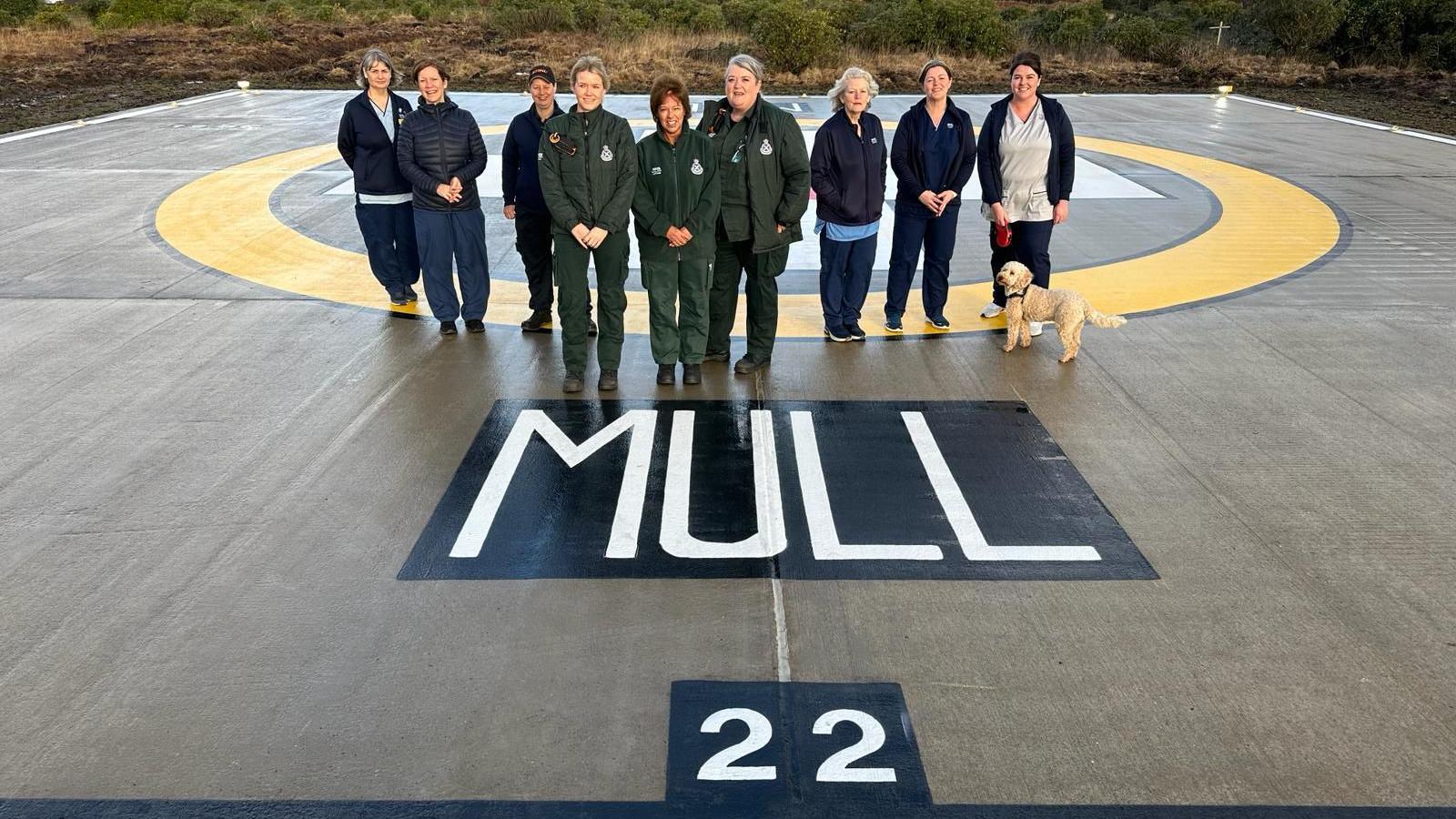 Healthcare workers on the new helipad