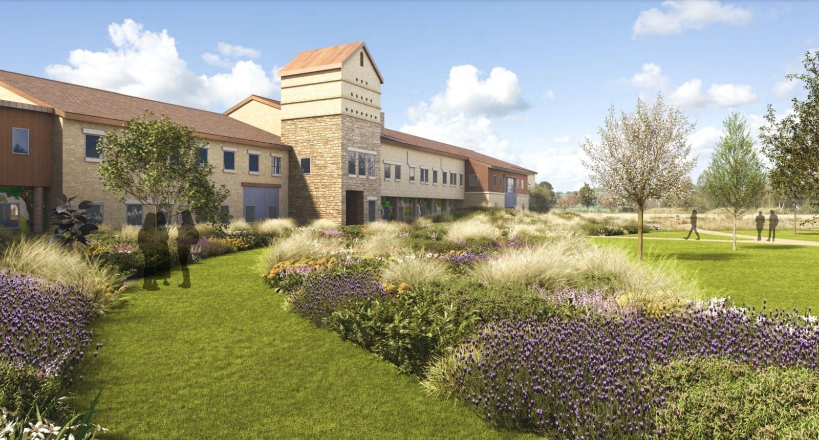 A CGI image of part of the planned campus. There is a pond and a bridge leading to the campus, which consists of brick houses with big glass windows.