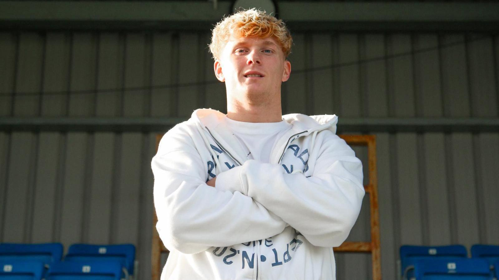 Sam Pearson poses for a photo while stood in Eastleigh's Silverlake Stadium