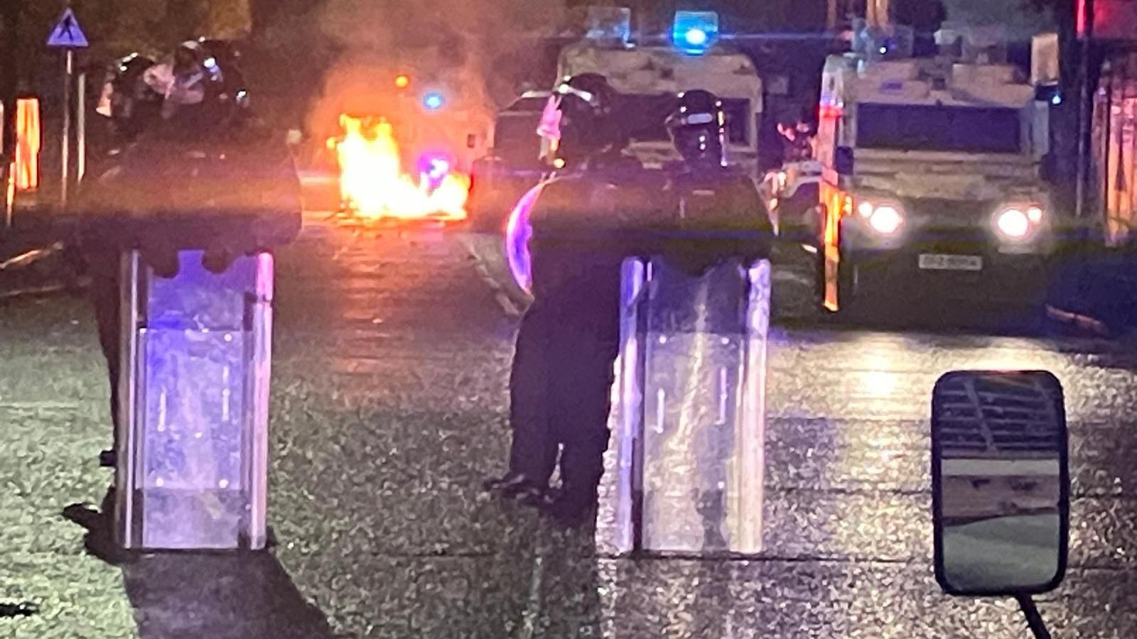 Rocks have been thrown at police in South Belfast tonight, in an area where a supermarket was burned out on Saturday