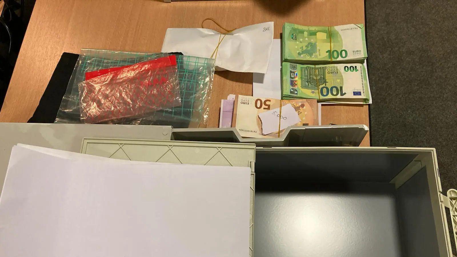 A picture released by Europol shows piles of cash seized in police raids.