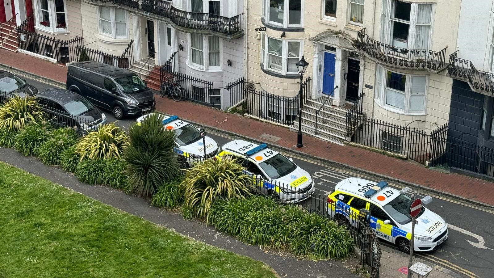 A street with police cars in Brighton