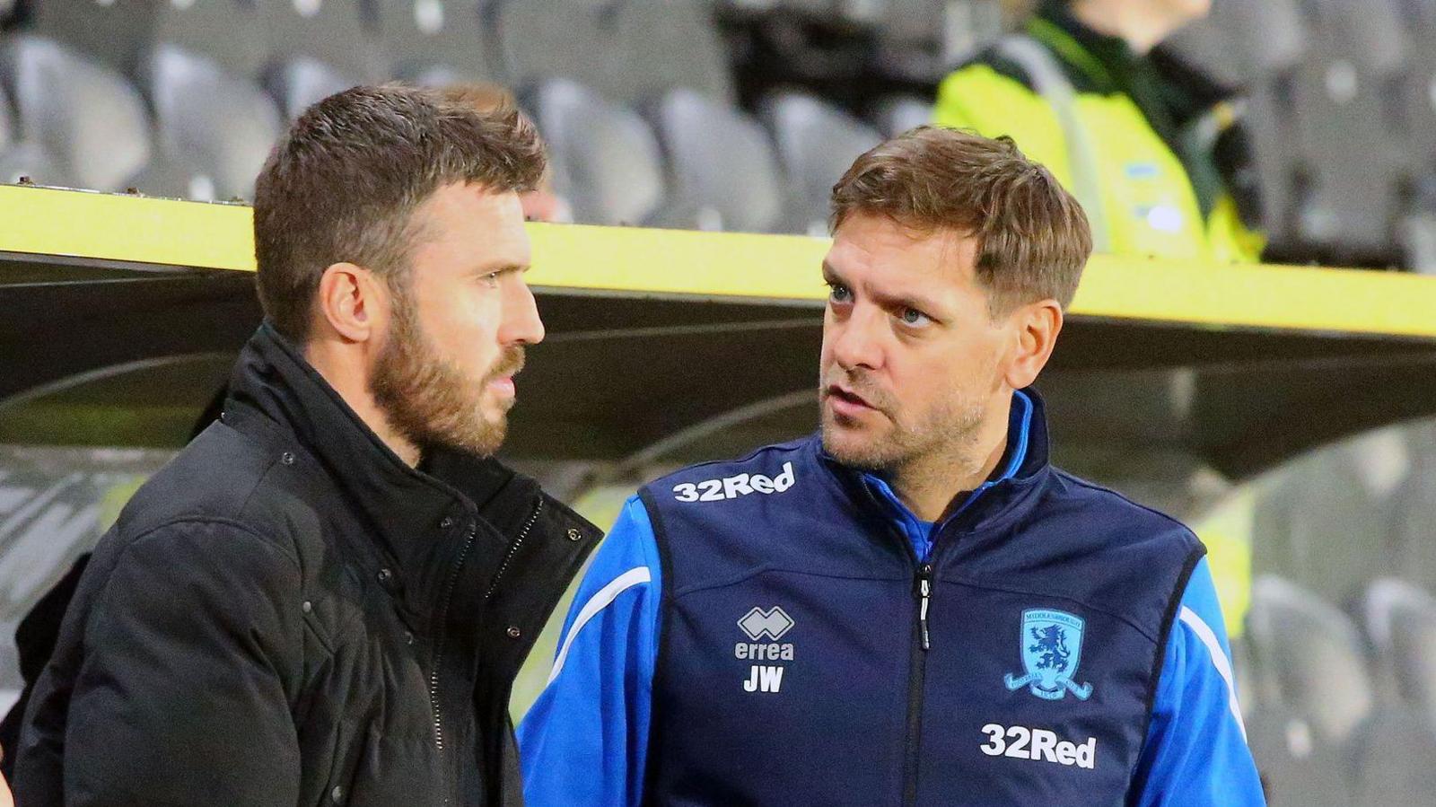 Michael Carrick and assistant Jonathan Woodgate in discussions during a Middlesbrough match