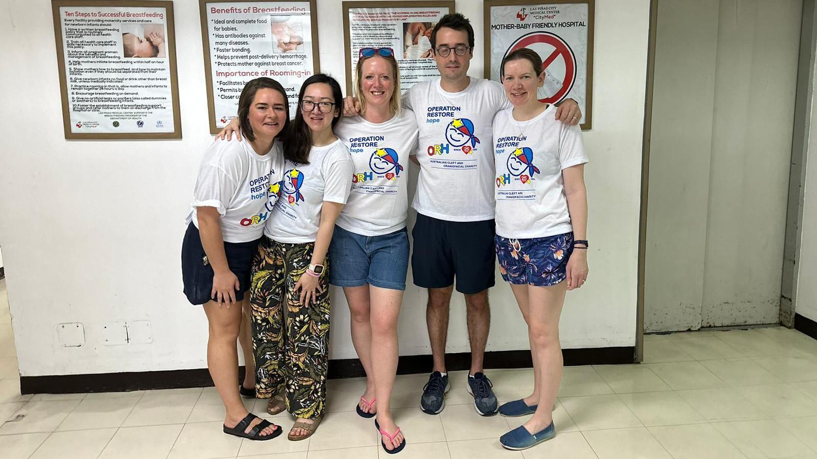 Some of the medical team wearing Operation Restore Hope T-shirts