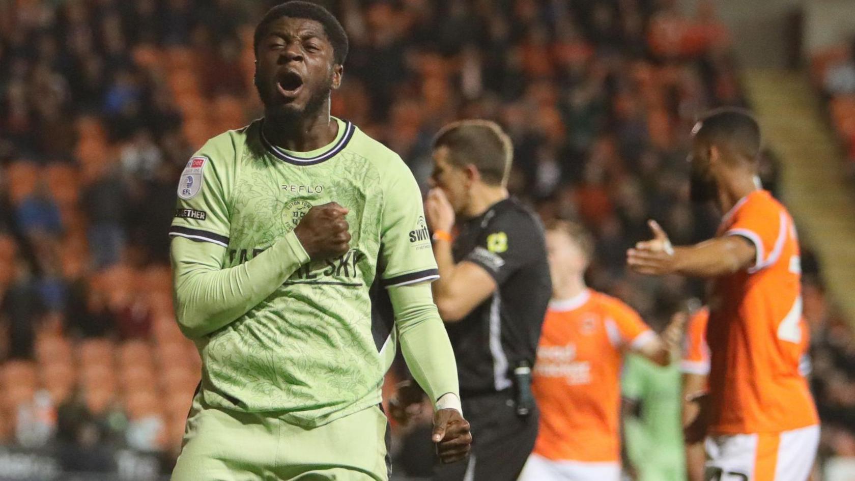 Gideon Kodua thumps his chest after scoring for Luton Town