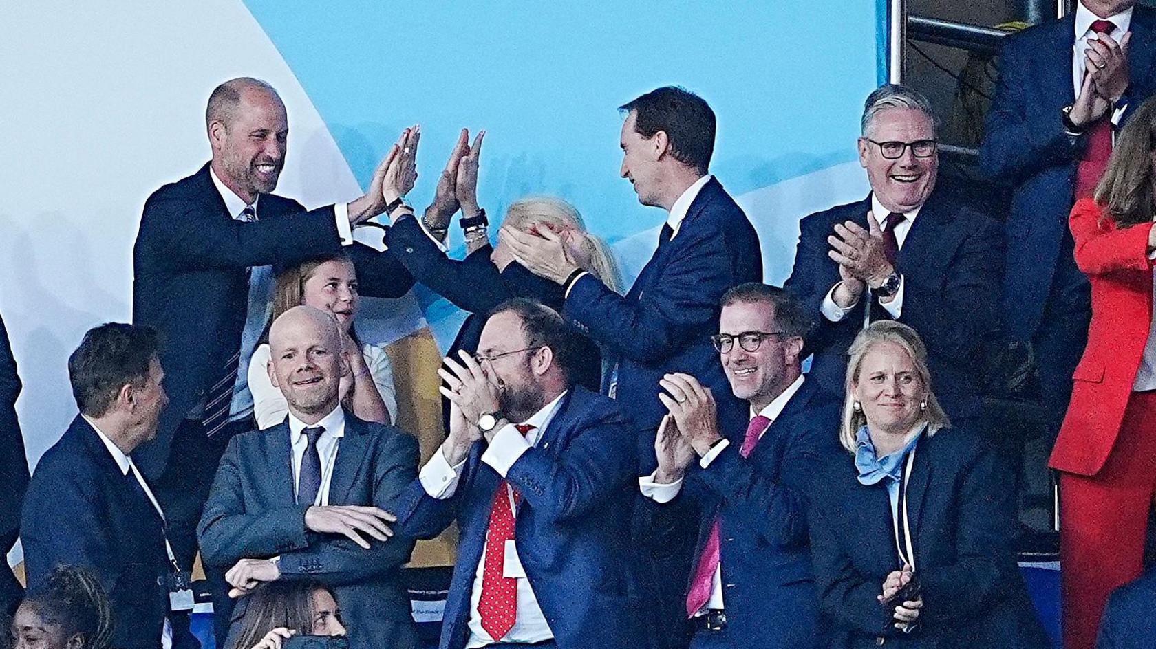 prince william celebrating in the stands with keir starmer clapping on the right