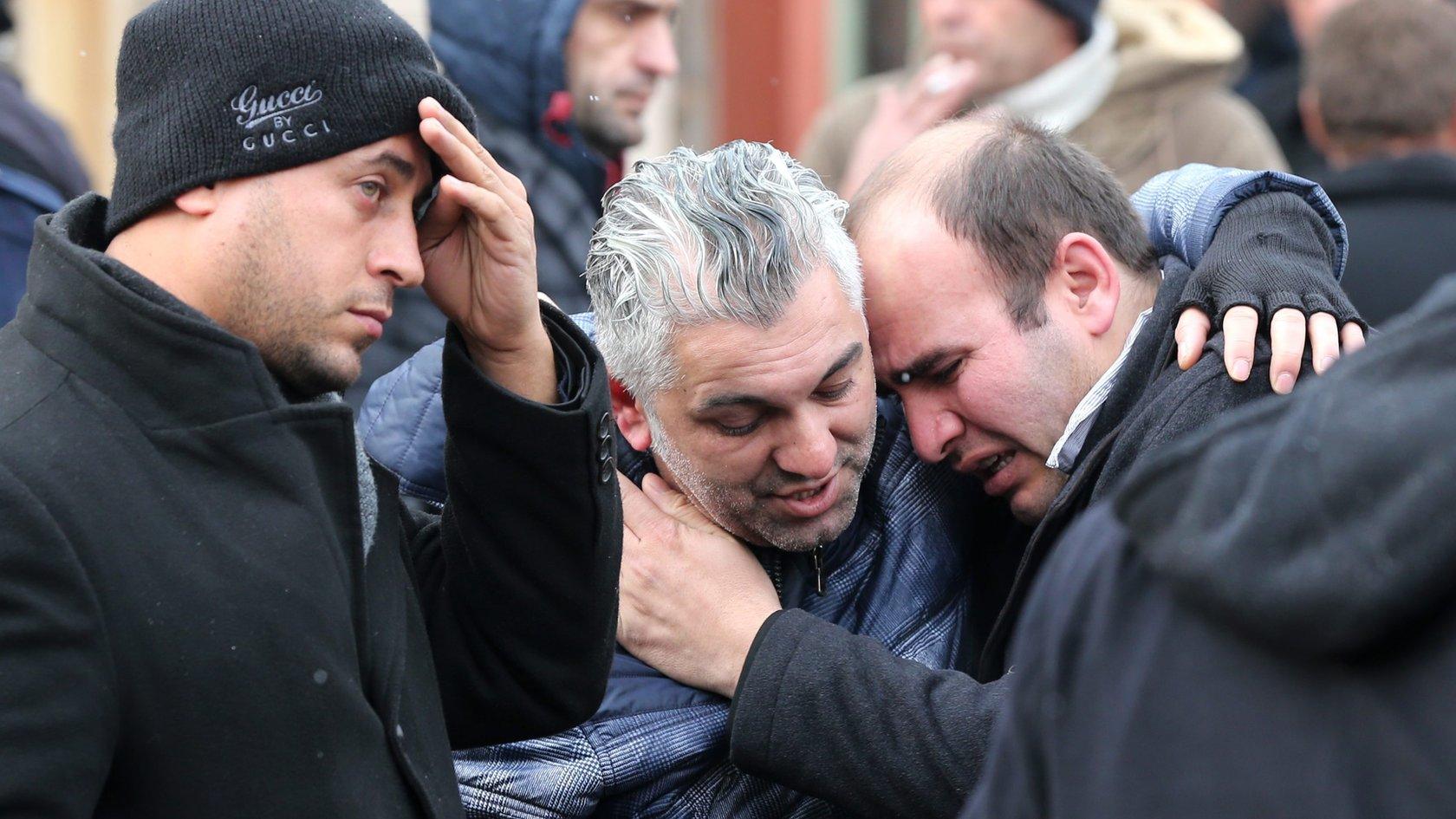 elatives of victims mourn in front in front of the forensic medicine institute after a gun attack on Reina, a popular night club in Istanbul near by the Bosphorus, early morning in Istanbul, Turkey