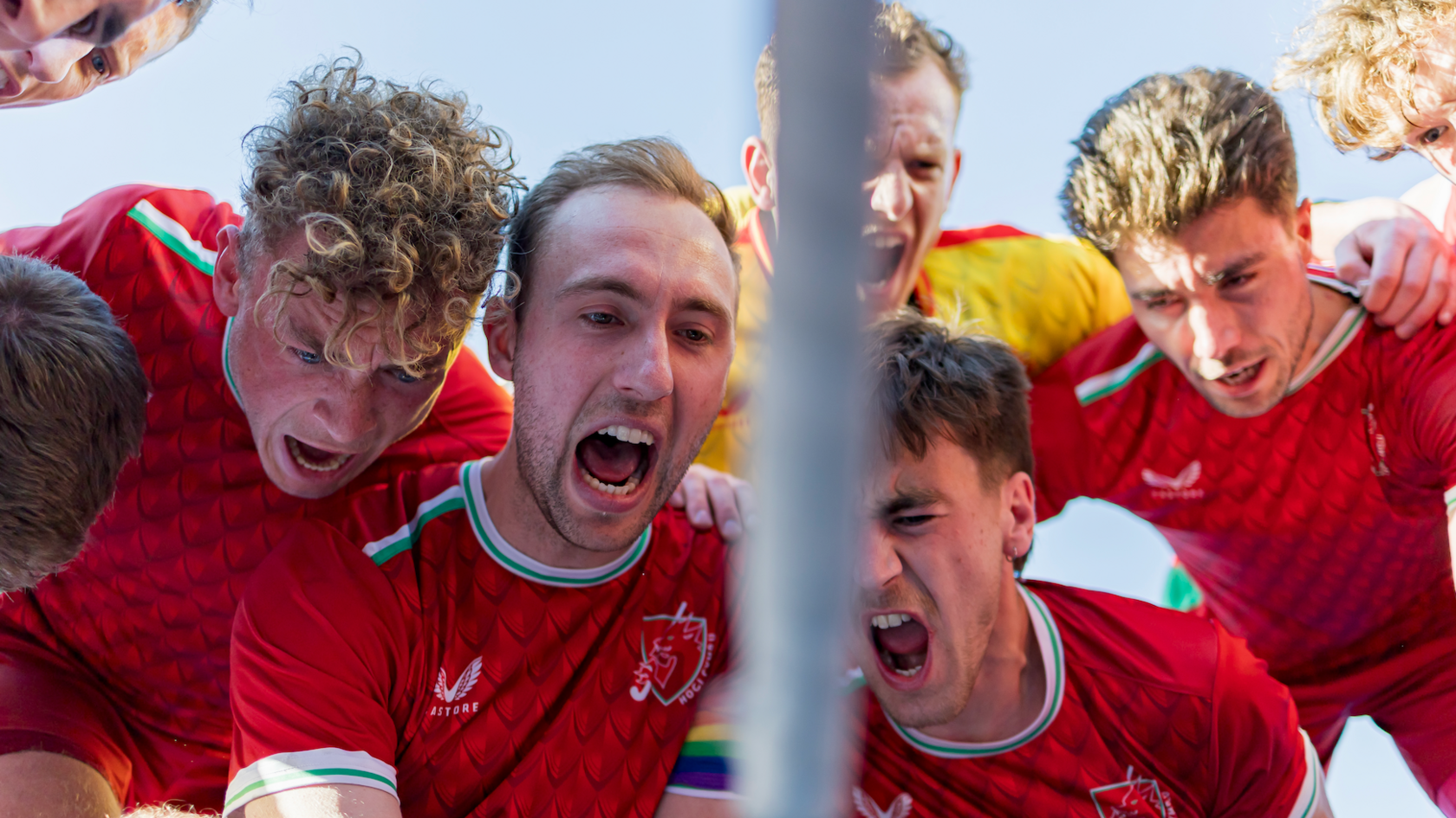 Wales' hockey team huddle before playing Scotland