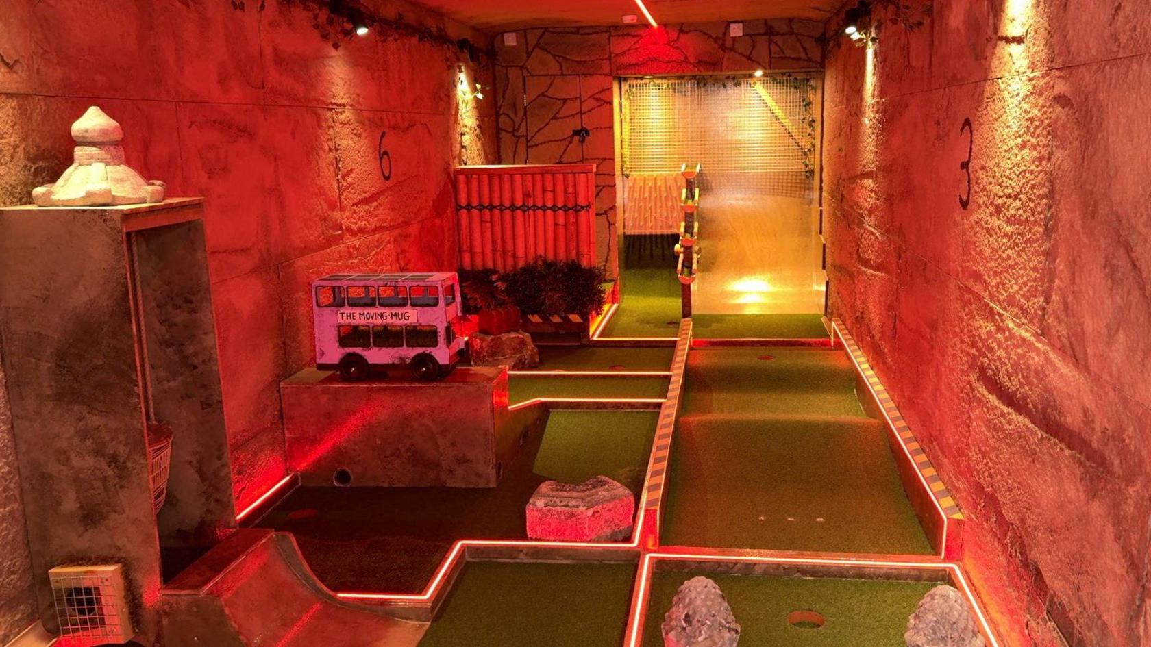 The inside of the lorry all lit with LEDs and with lots of golf holes