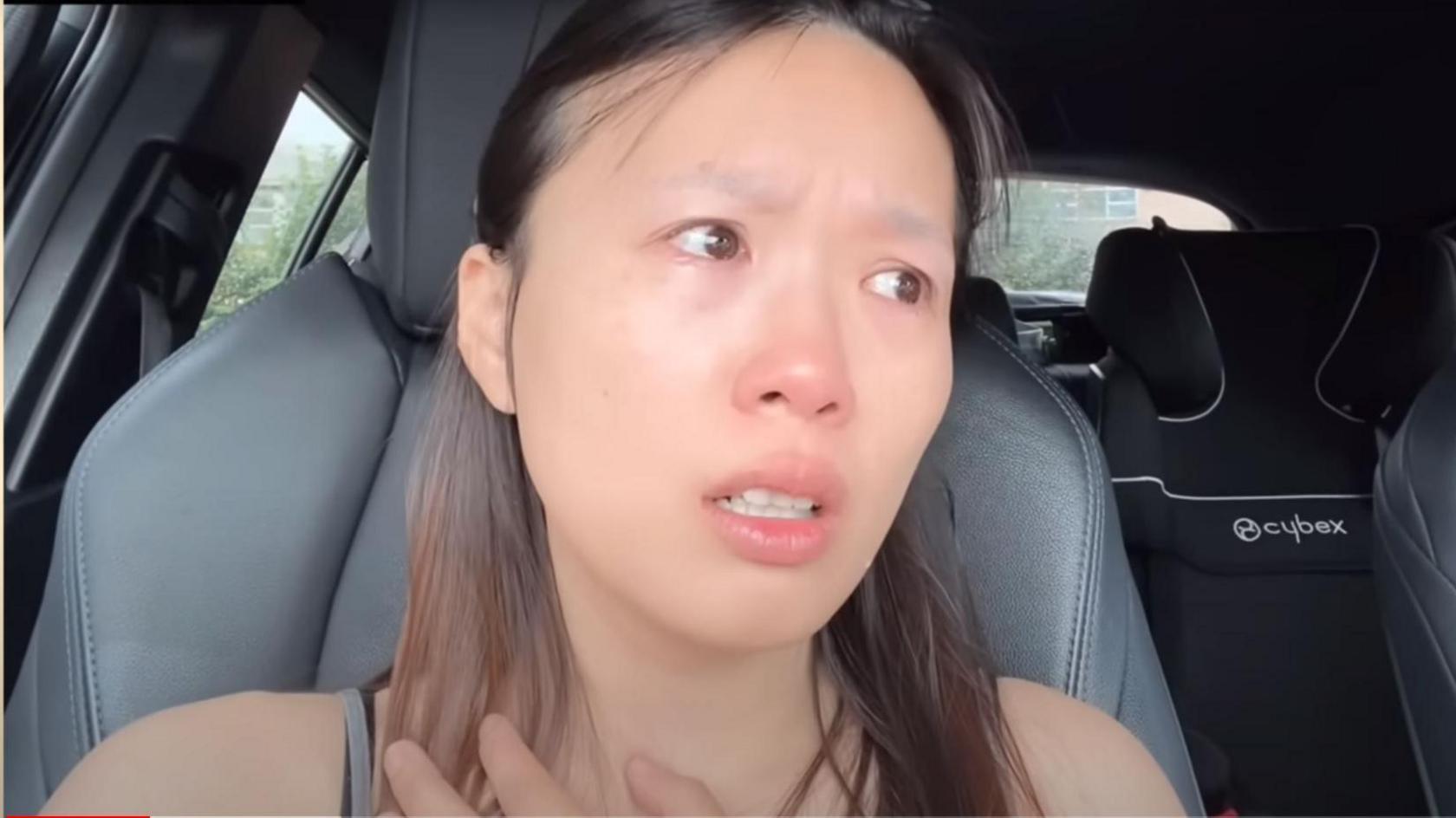 Screenshot of Kasumi Law's Youtube video that went shows her tearful and sitting in her car.