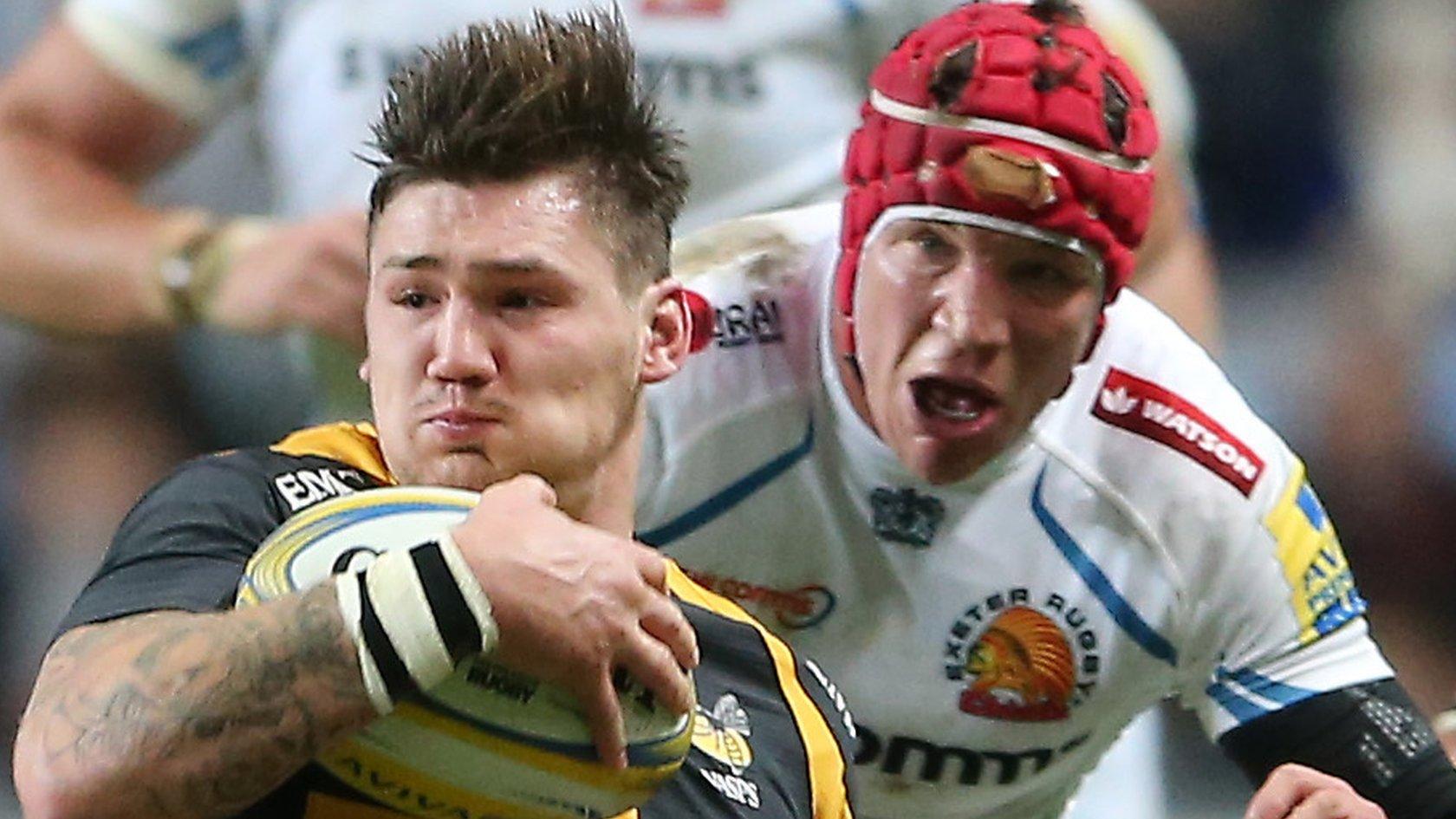 Dan Thompson of Wasps is tackled by Henry Slade of Exeter