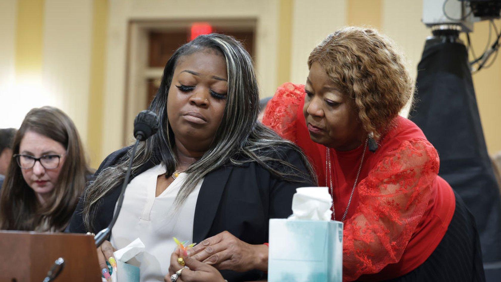 Wandrea ArShaye “Shaye” Moss, former Georgia election worker, is comforted by her mother