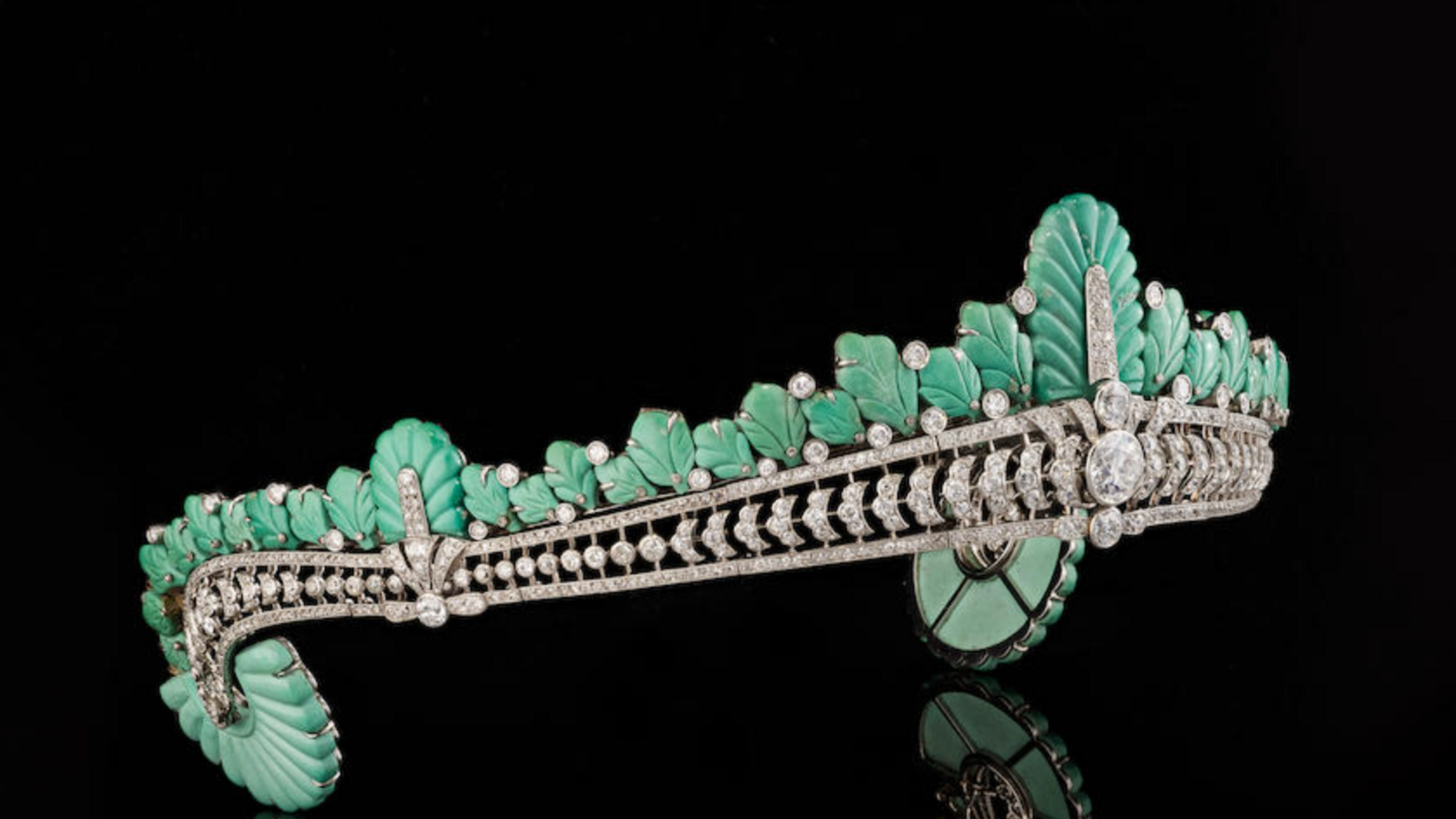 The tiara from the side showing the turquoise plumage and large diamond at the centre.