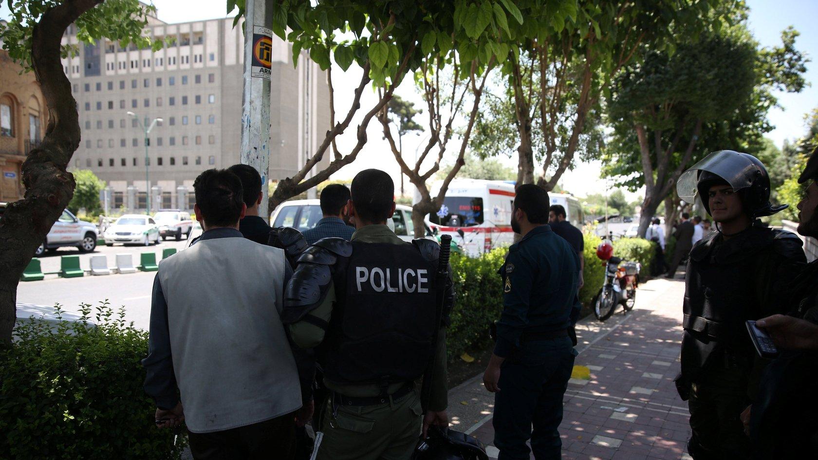 Iranian police stand near the parliament"s building during a gunmen attack in central Tehran, Iran,7 June 2017.