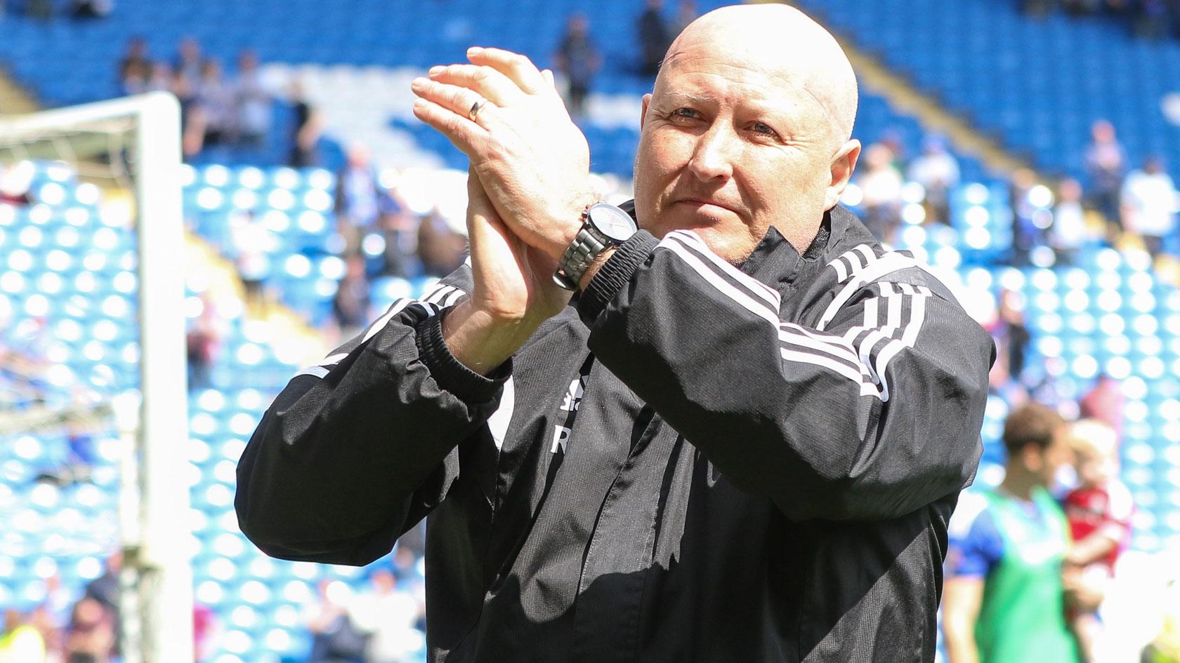 Russell Slade applauds Cardiff City's fans after his final game in charge of the first team