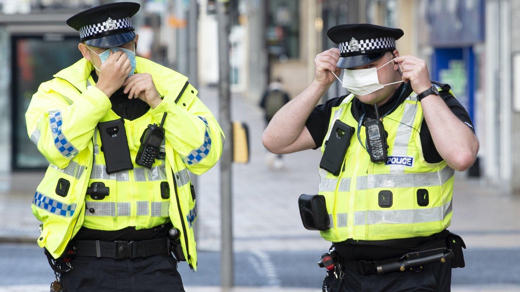 Masked police officers