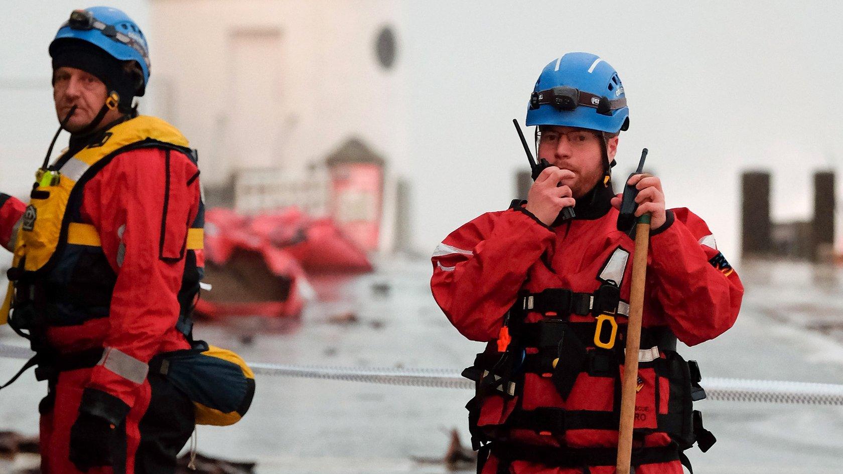 Members of the Coastguard Rescue helping with tidal surge aftermath