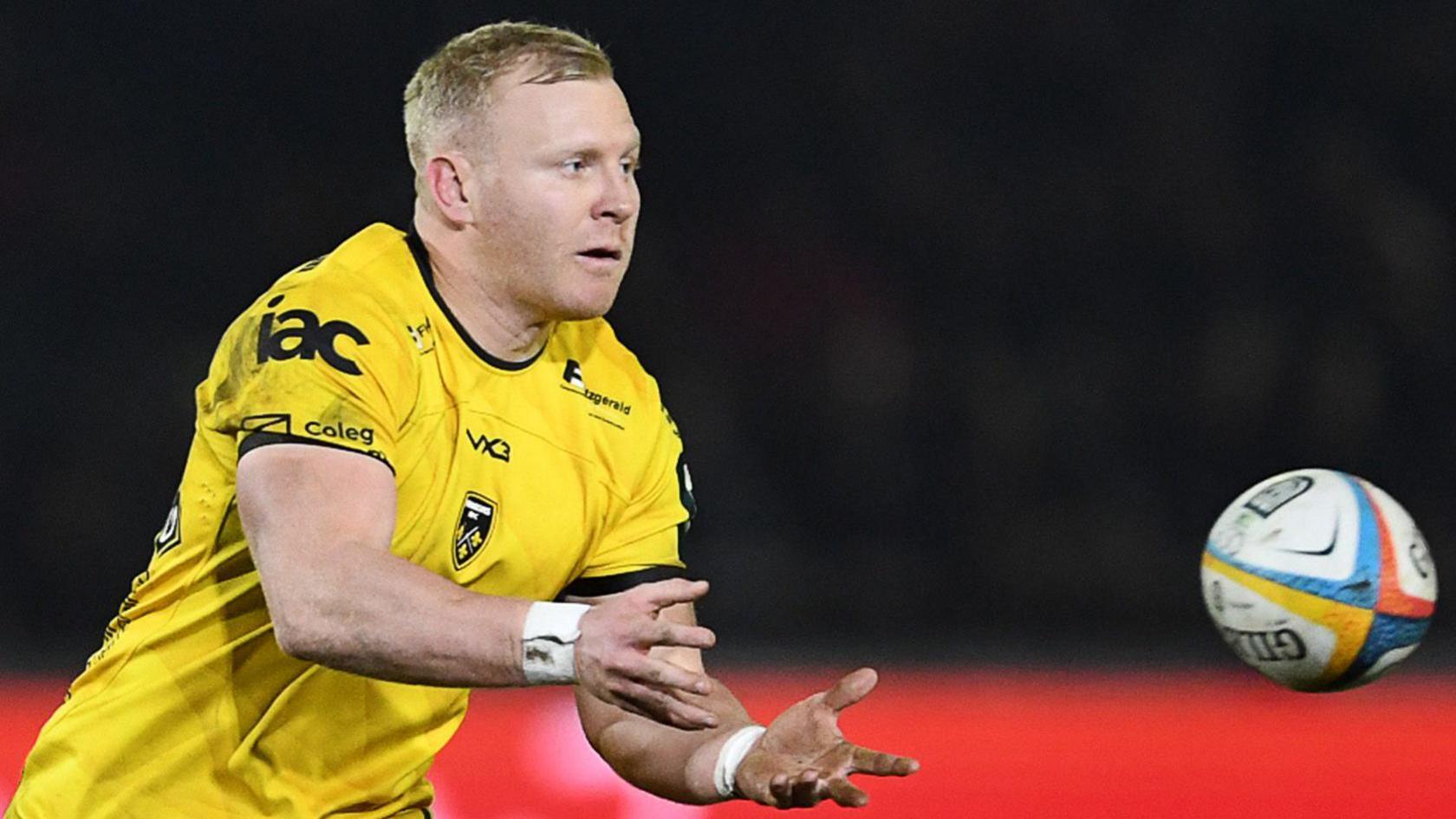 Tinus de Beer passes the ball for Dragons against Ospreys
