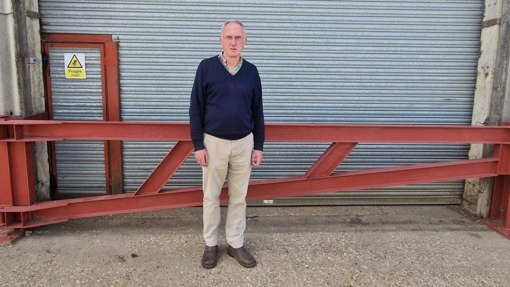 Simon Porter in front of shed