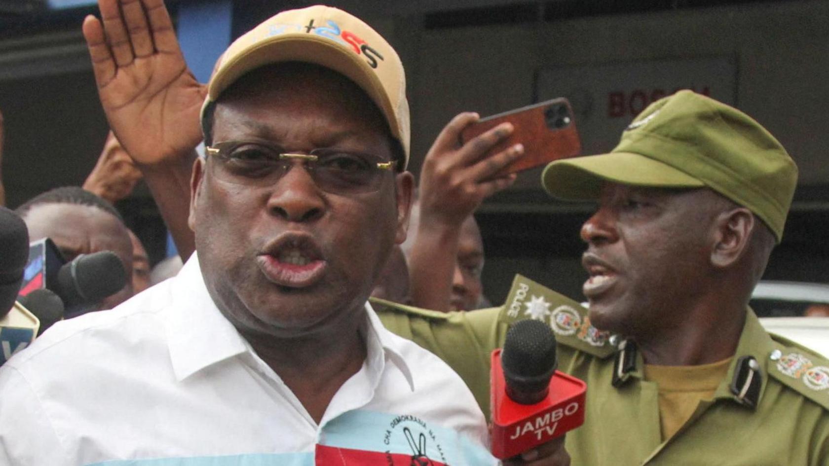 Tanzania's main opposition party Chadema's chairman Freeman Mbowe reacts as he is detained by Tanzania police during the protests to condemn a series of kidnappings and murders within the Magomeni area of Dar es Salaam, Tanzania, September 23, 2024.