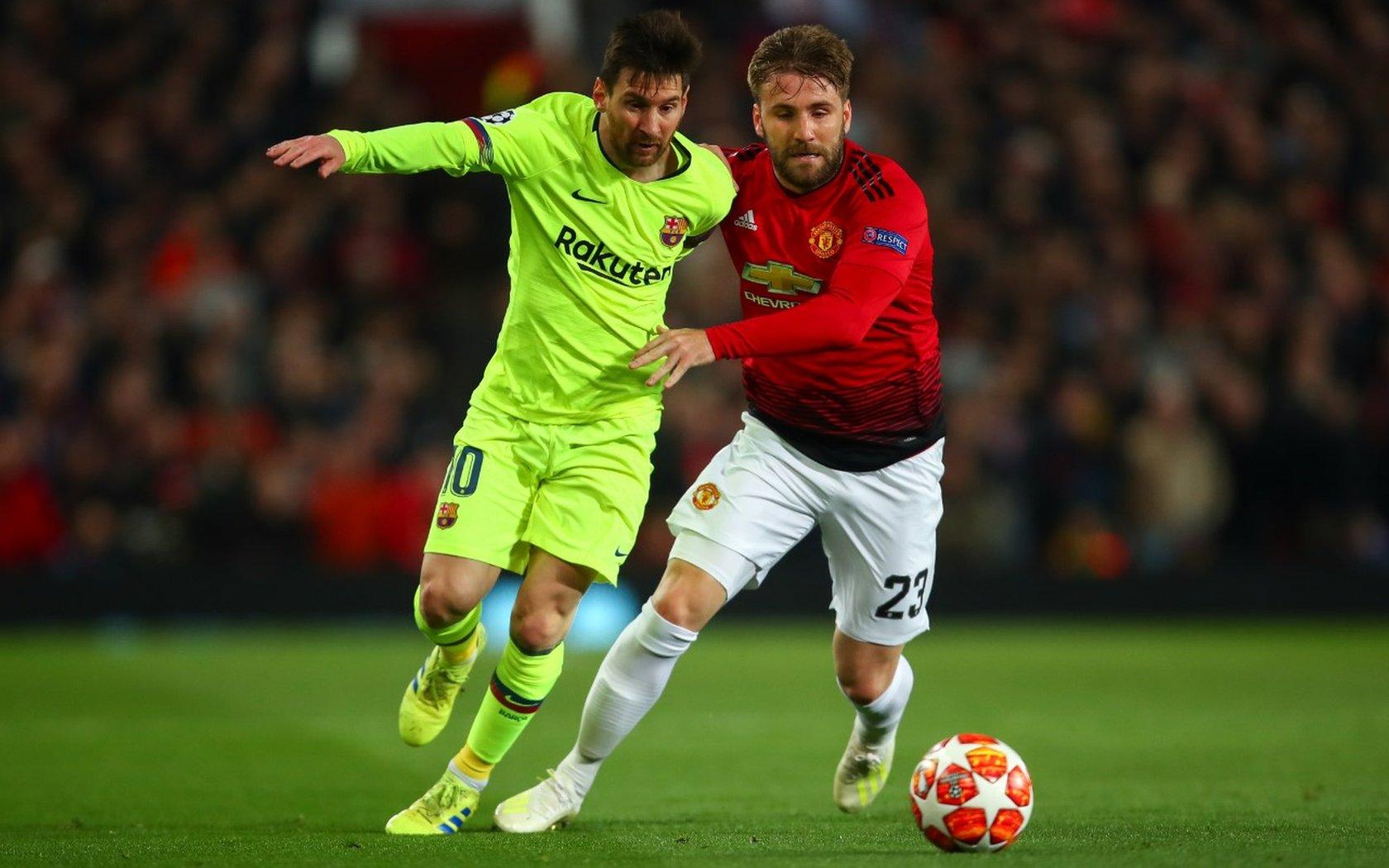 Lionel Messi of FC Barcelona and Luke Shaw of Manchester United during the UEFA Champions League Quarter Final first leg match