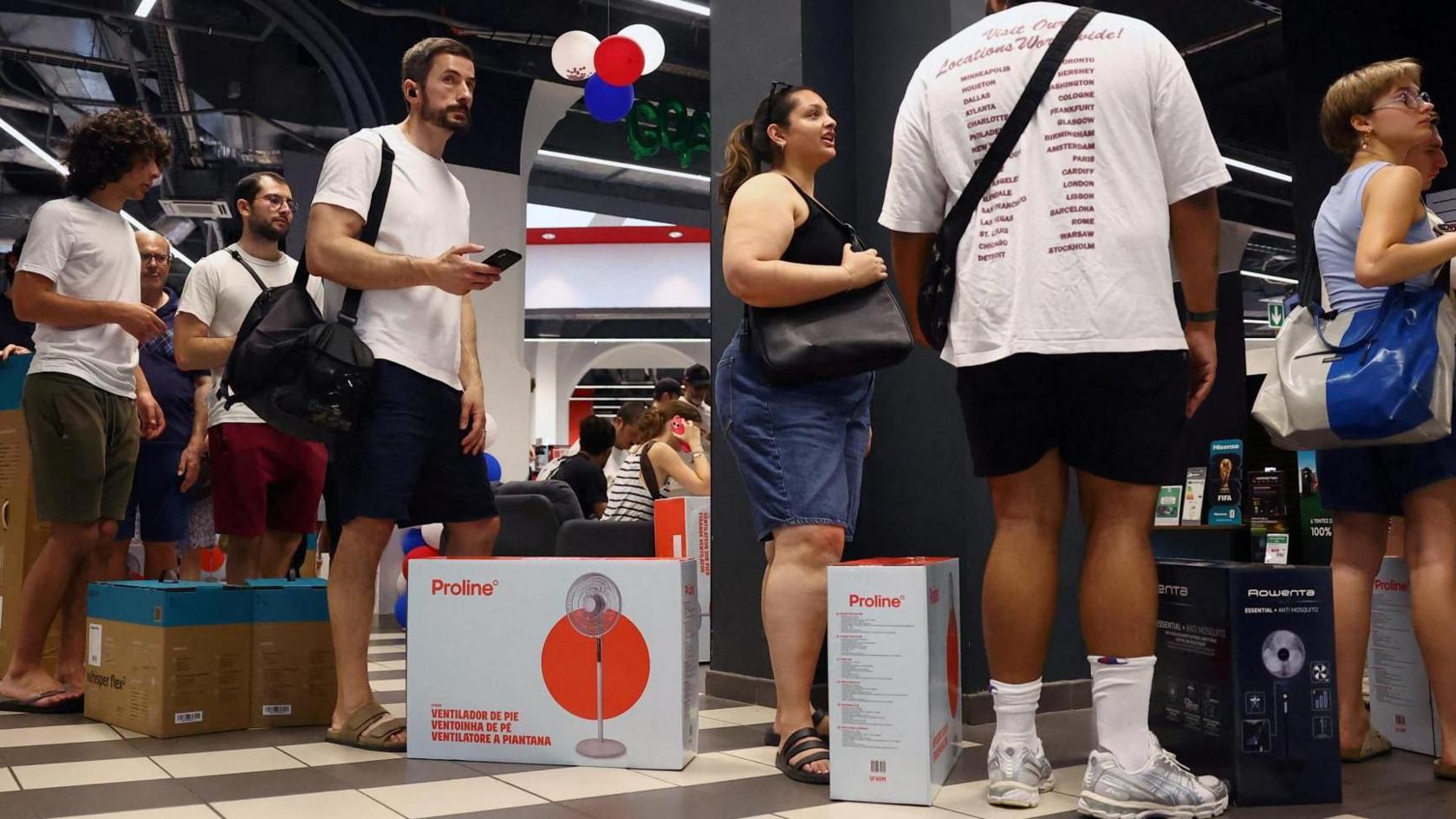 People queue to buy fans in Paris