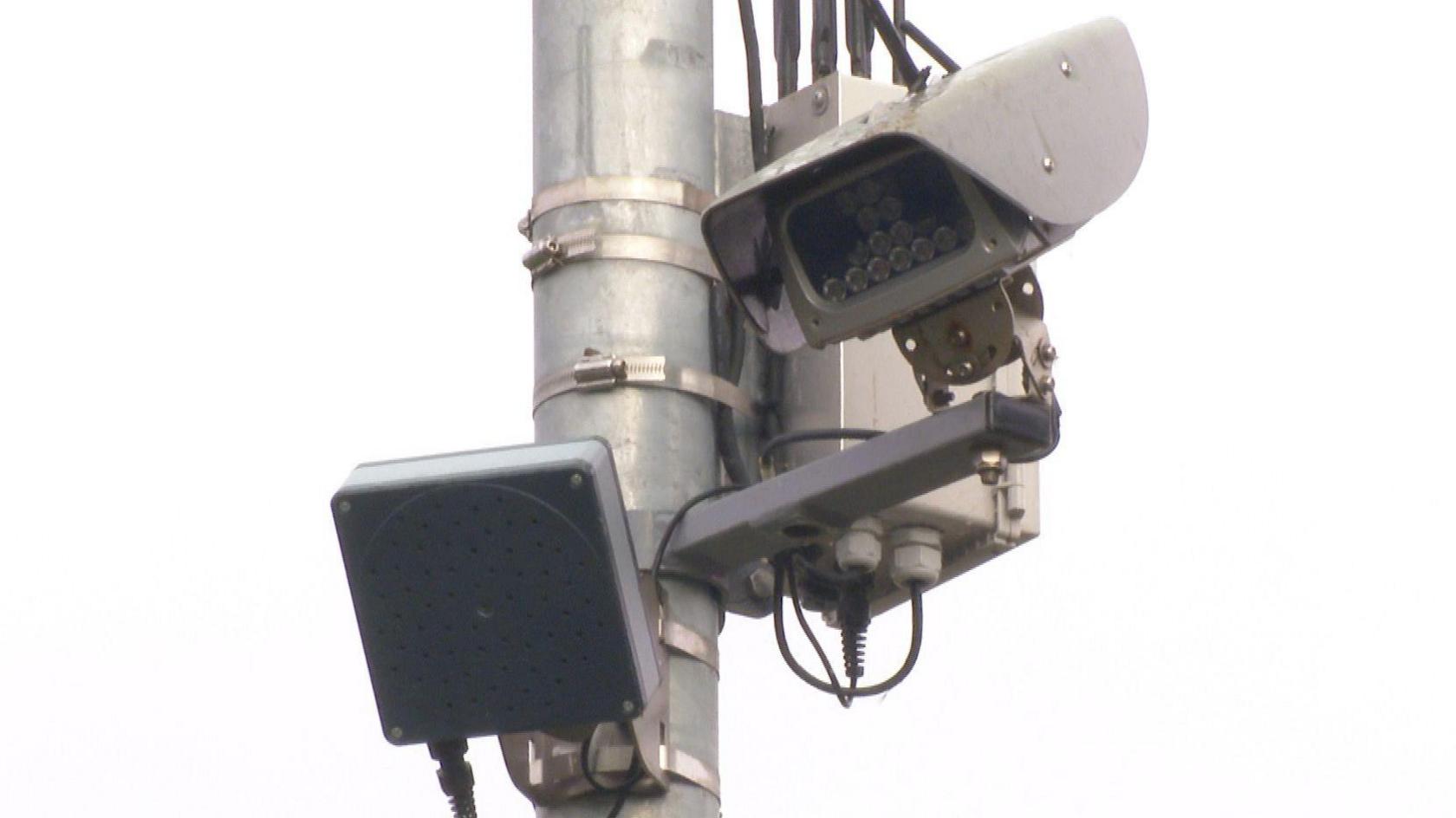 A noise camera attatched high up an a street lamp in Exmouth