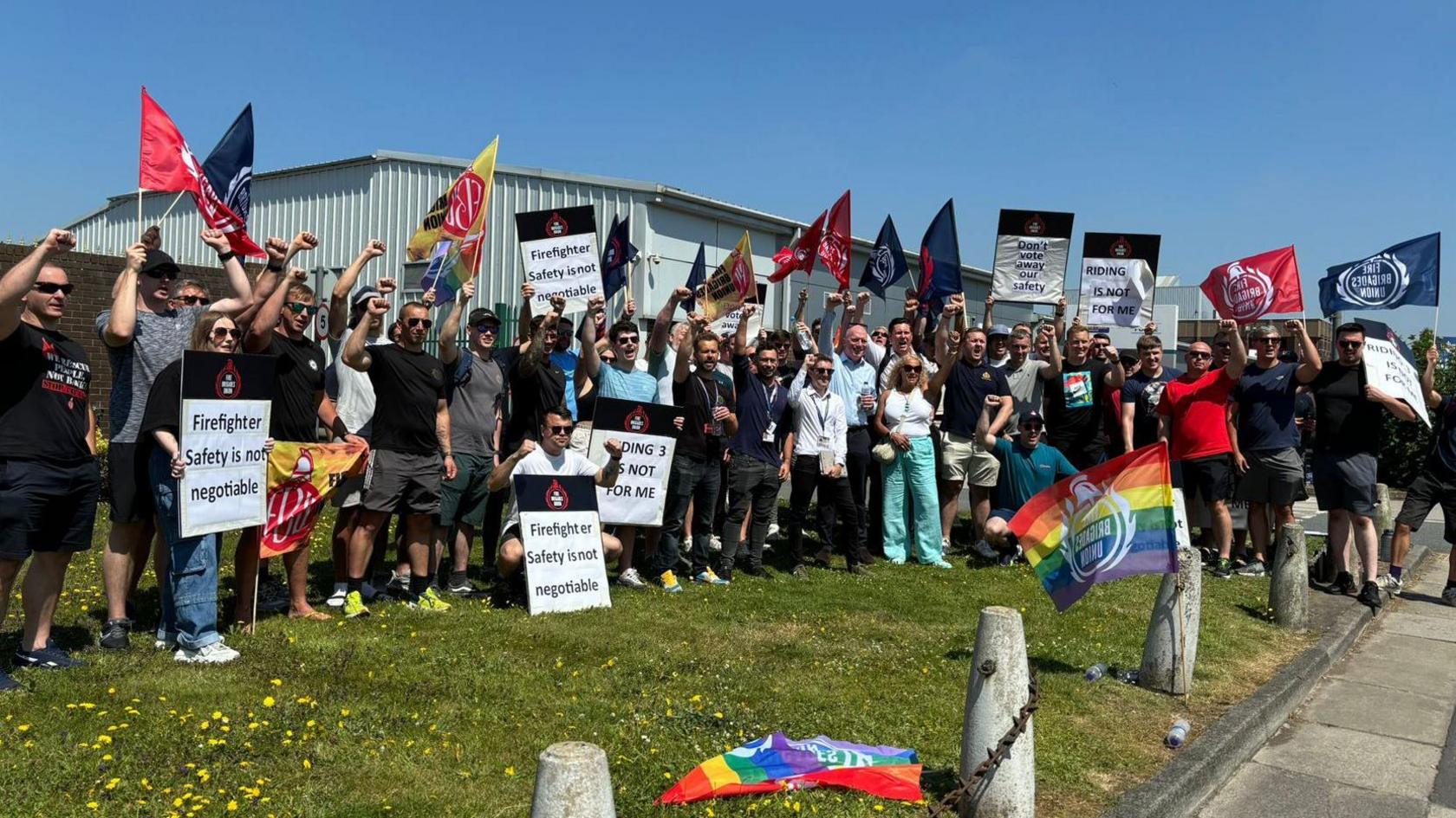 Fire Brigade's Union protest showing group of people holding banners