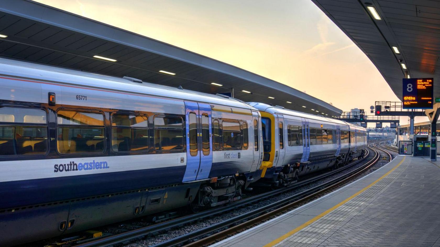 A white southeastern train waiting at platform at London Bridge station in April 2019, including first class accomodation