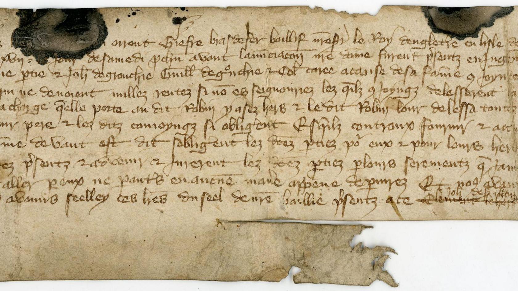 An old written document on brown paper.