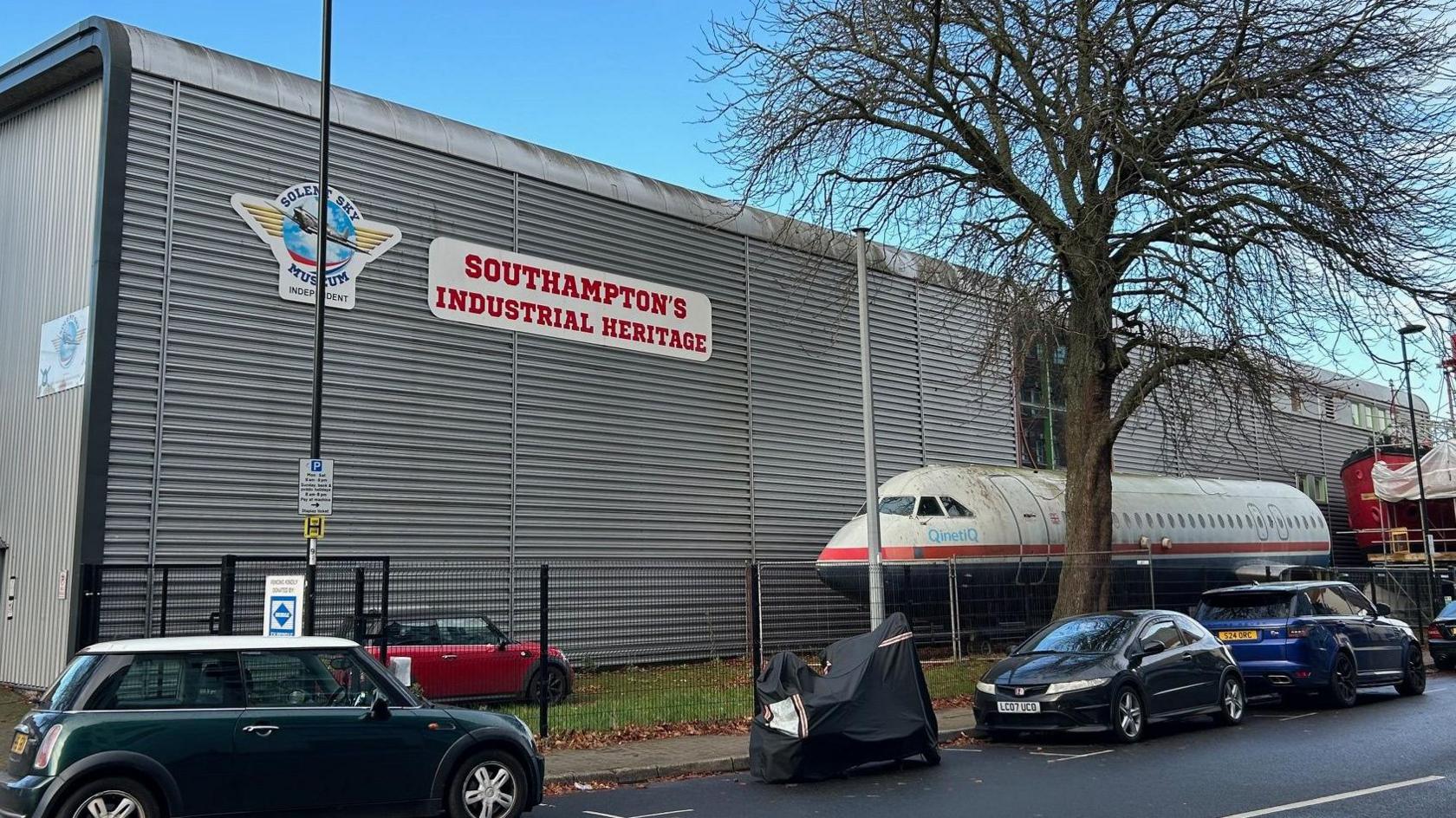 Solent Sky Museum in Albert Road South, Southampton. It is building made from corrugated metal. At the front of a building is the body of an aeroplane with no wings. 