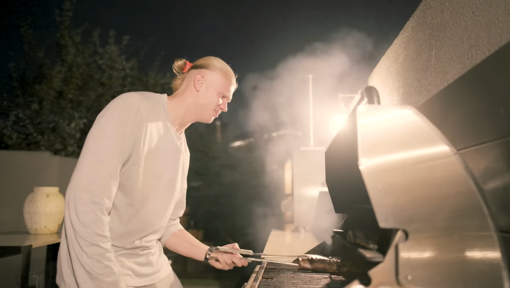 Haaland cooking steak on the bbq