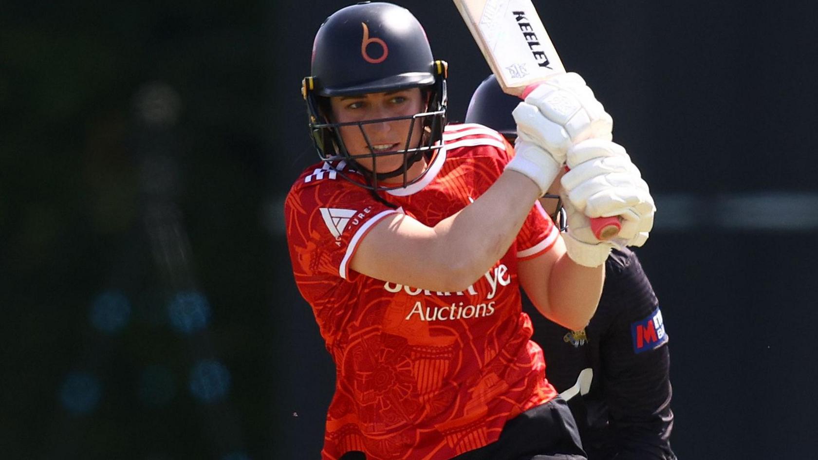 Marie Kelly watches after hitting a shot through the legside for The Blaze 