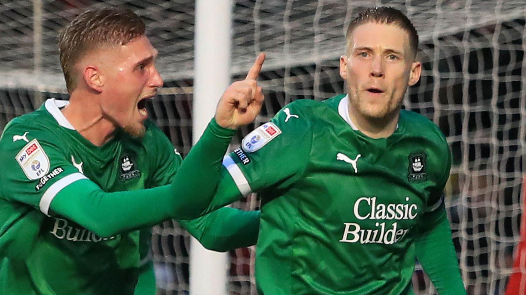 Lewis Gibson celebrates scoring for Plymouth