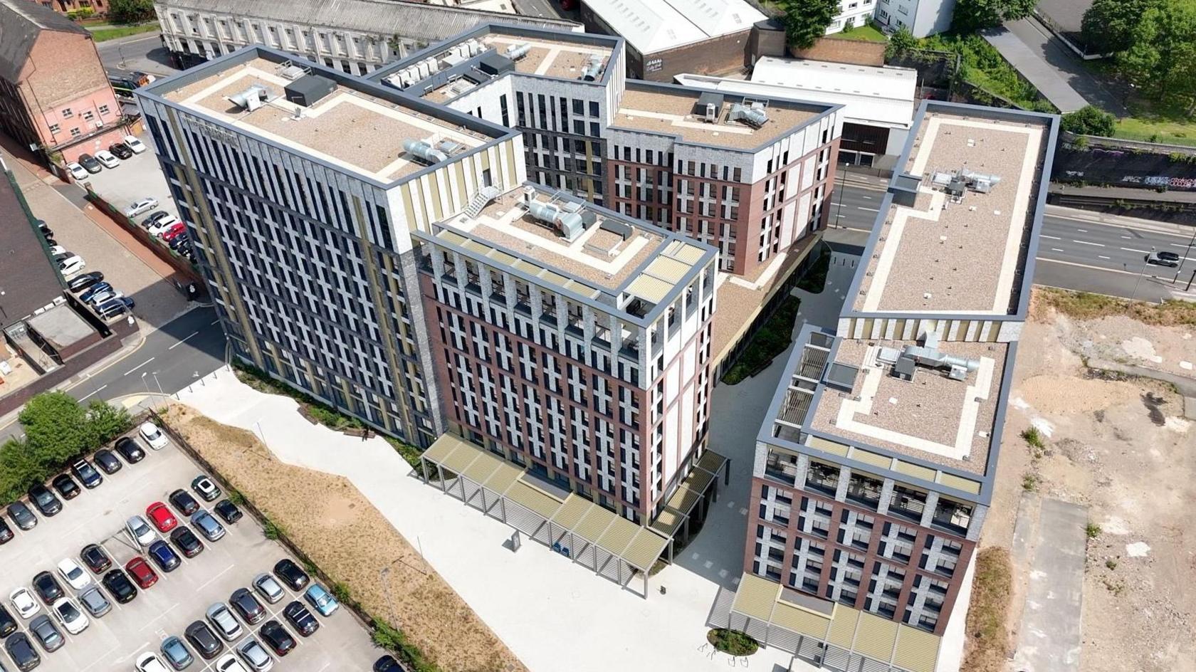 A drone shot shows the recently-completed blocks of Winfield Court