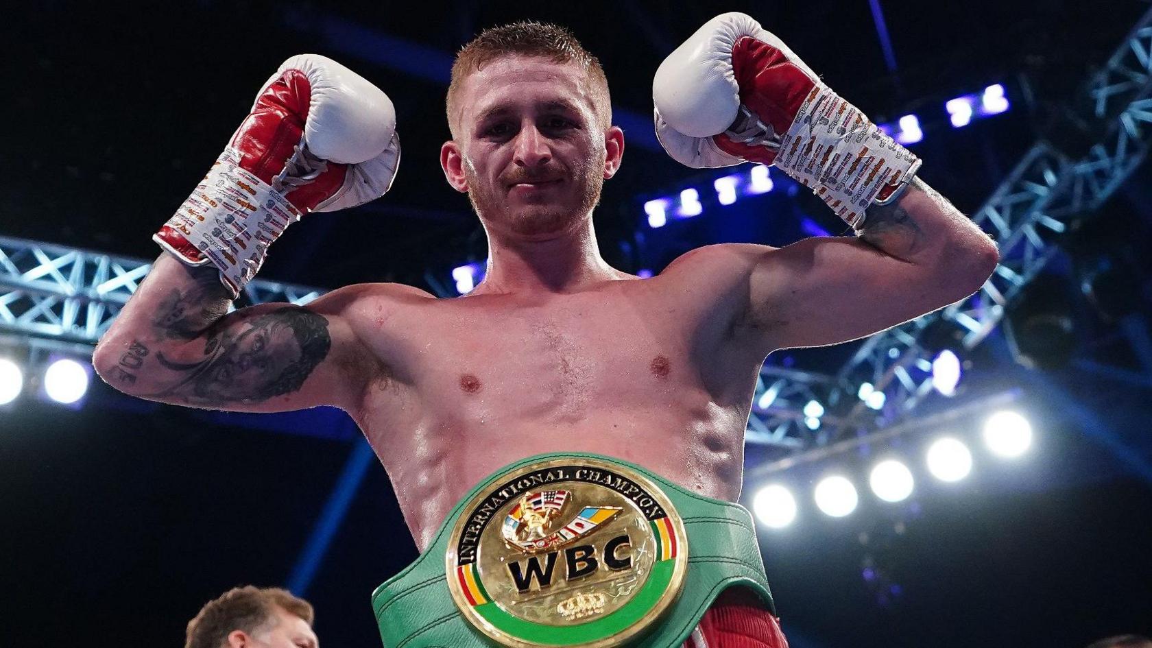 Ryan Garner poses for a photo after victory