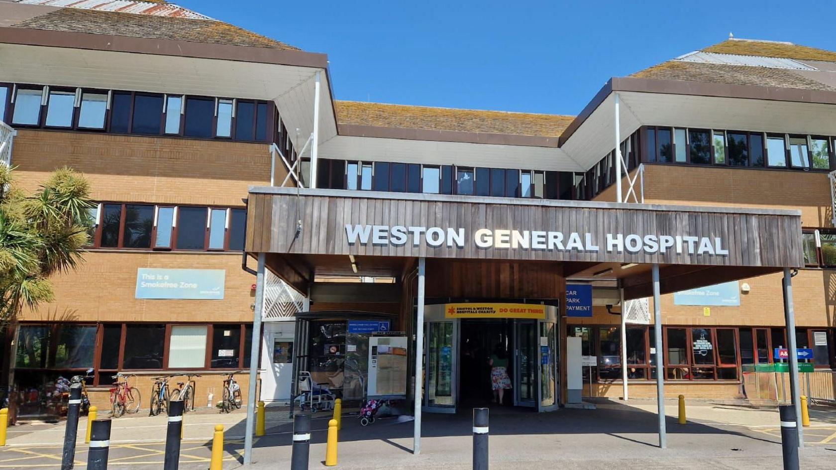 The front entrance of Weston General Hospital, a beige building with an entrance at the front