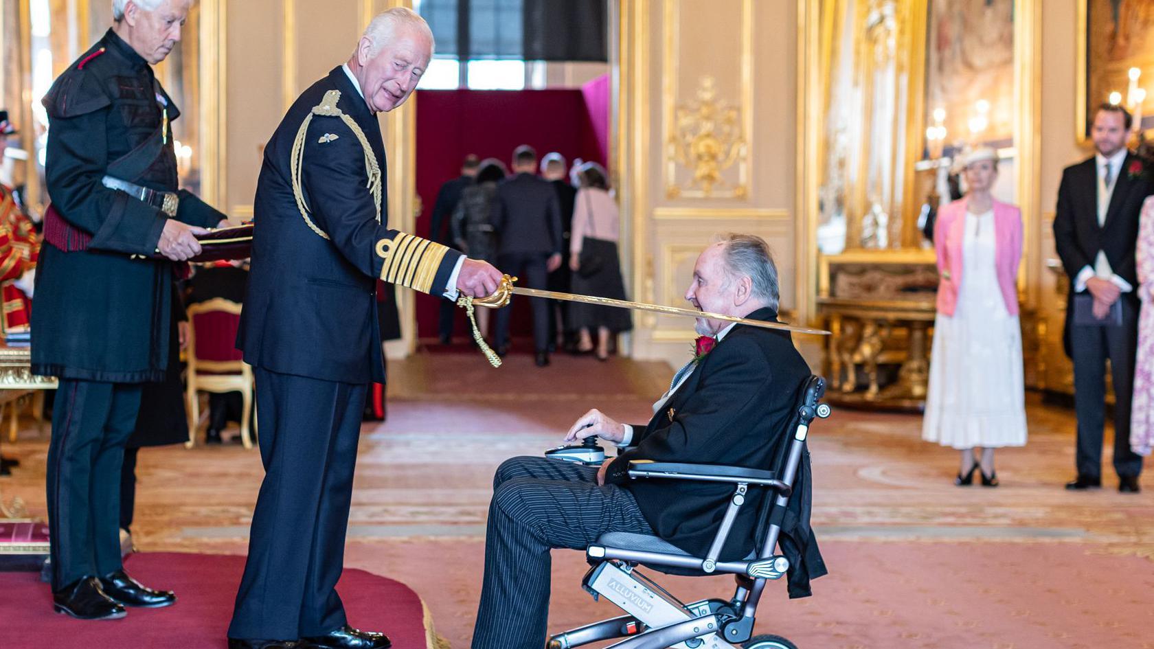 Sir Richard 'Dicky' Evans is knighted by King Charles