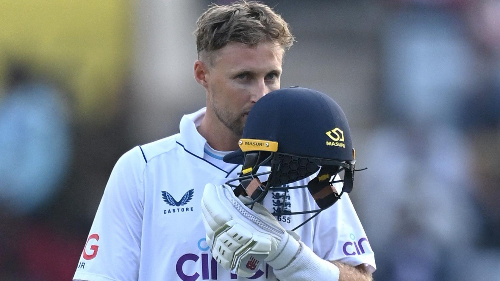 Joe Root celebrates a century