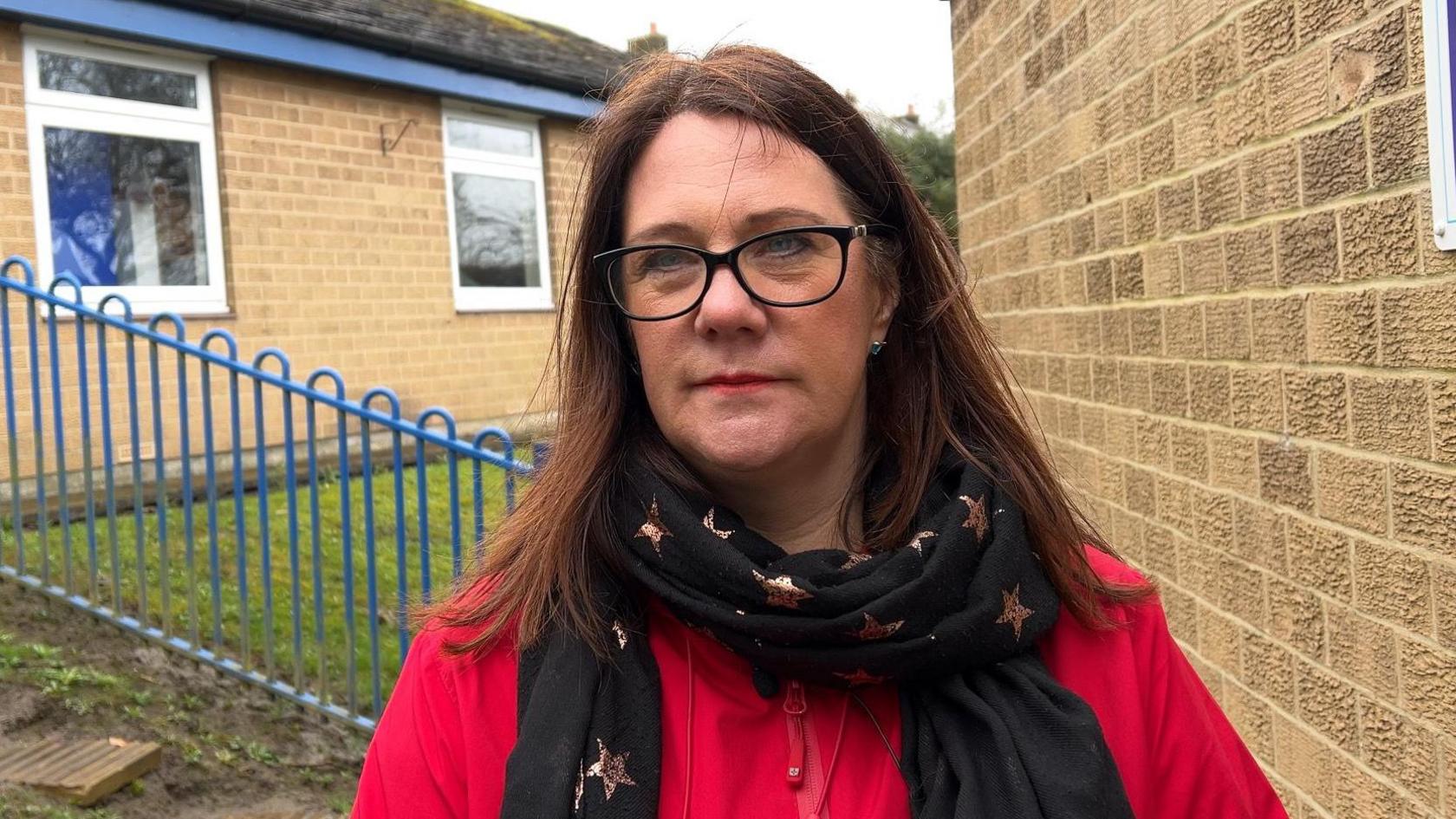 Deputy Headteacher Emma Crisell pictured in front of the school