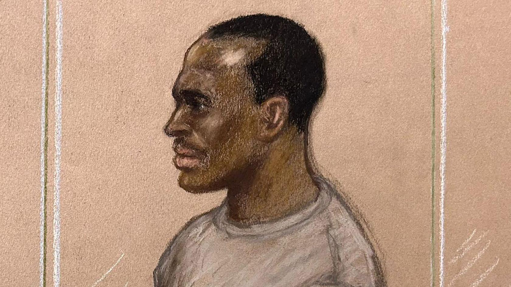 A court sketch of Hadush Kebatu standing in the dock at court. He is wearing a grey sweater and has short black hair.