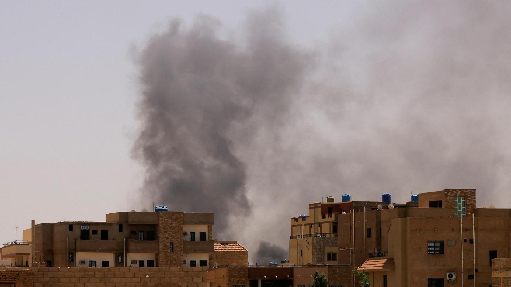  Smoke is seen rise from buildings during clashes in Khartoum